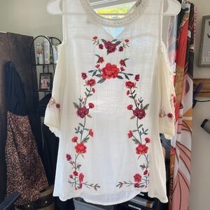 Johhny was look white shirt with pink floral pattern